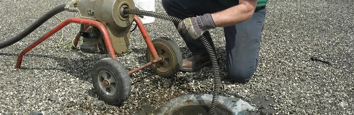 sewer rodding technician actively removing blockages from a sewer line in Myrtle Beach, SC